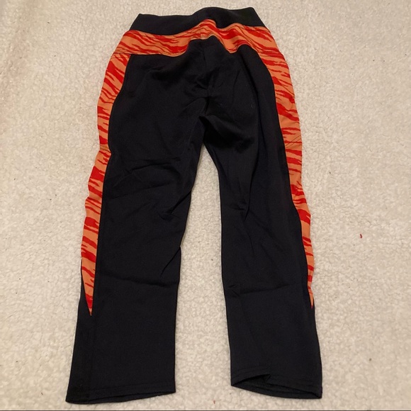BLACKMILK Black crop leggings with orange tiger print trim - Picture 2 of 6